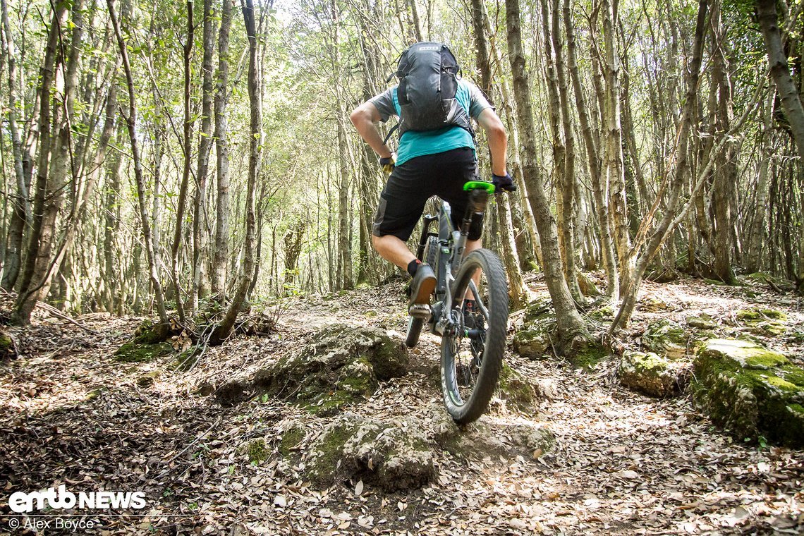 Keep it moving and redahjust the angle of the bike as the pedals on the other side come close to striking