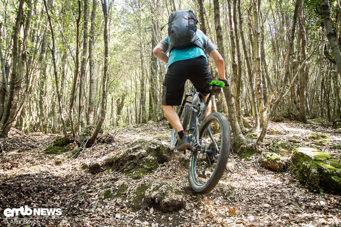Lean the bike whilst pedalling to avoid a rock strike