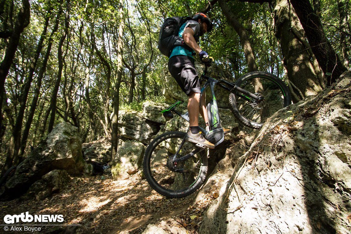 This is the critical moment and when mario adds the hop, dragging the back of the bike up the front of the step up.
